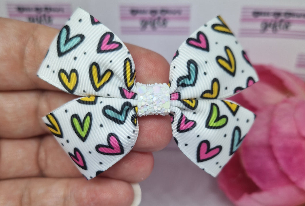 Small bright hearts ribbon bow