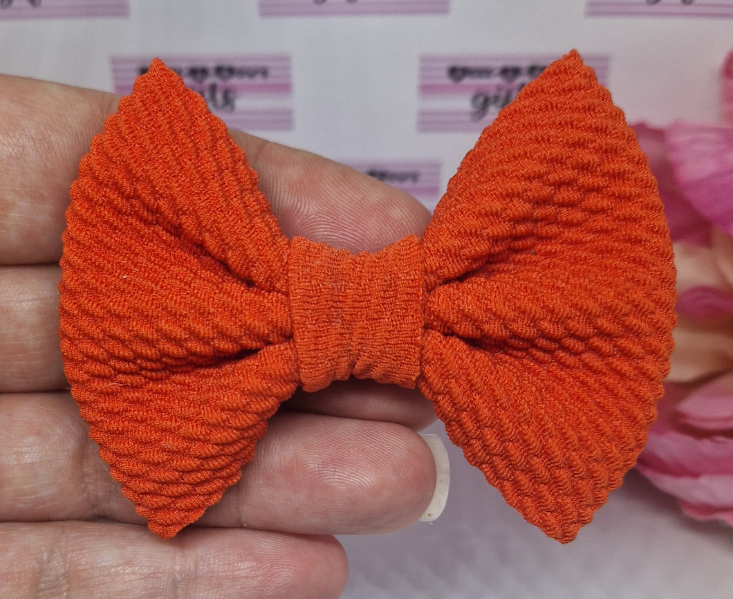 Orange bullet bow