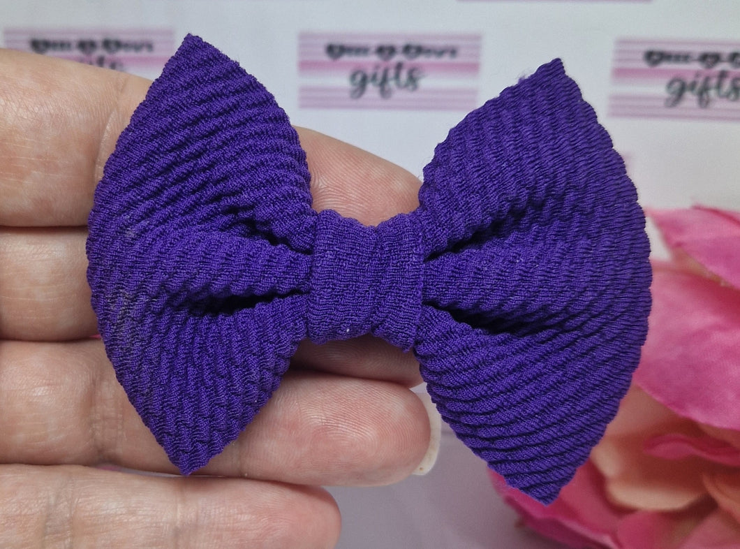 Purple bullet bow