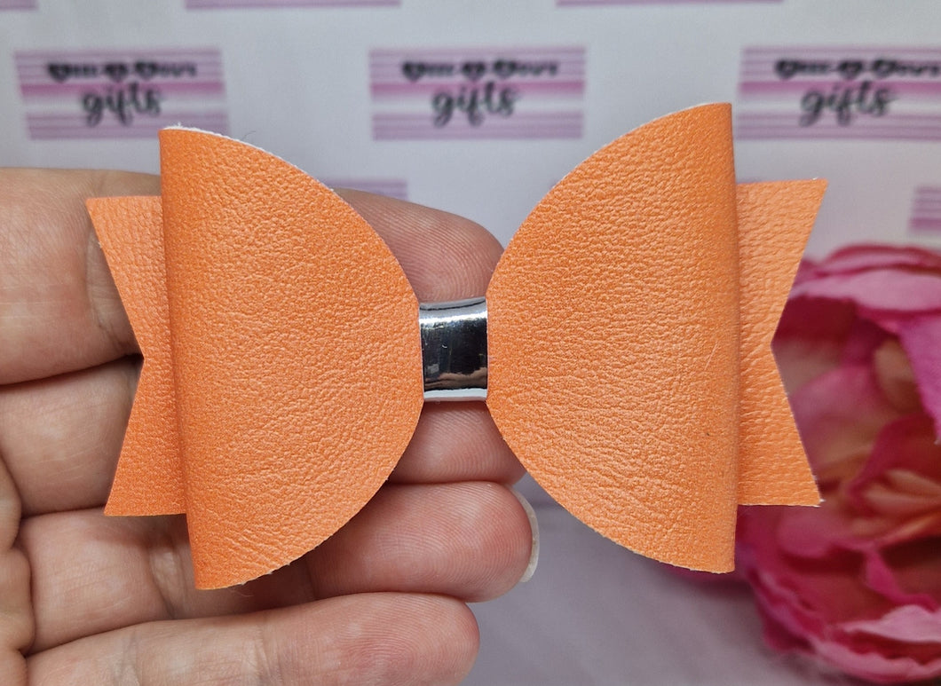 Peachy leatherette bow