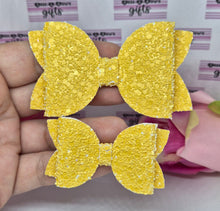 Load image into Gallery viewer, Darker yellow glitter bow
