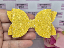 Load image into Gallery viewer, Darker yellow glitter bow
