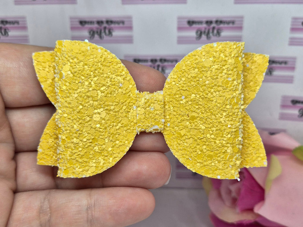 Darker yellow glitter bow