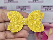 Load image into Gallery viewer, Darker yellow glitter bow
