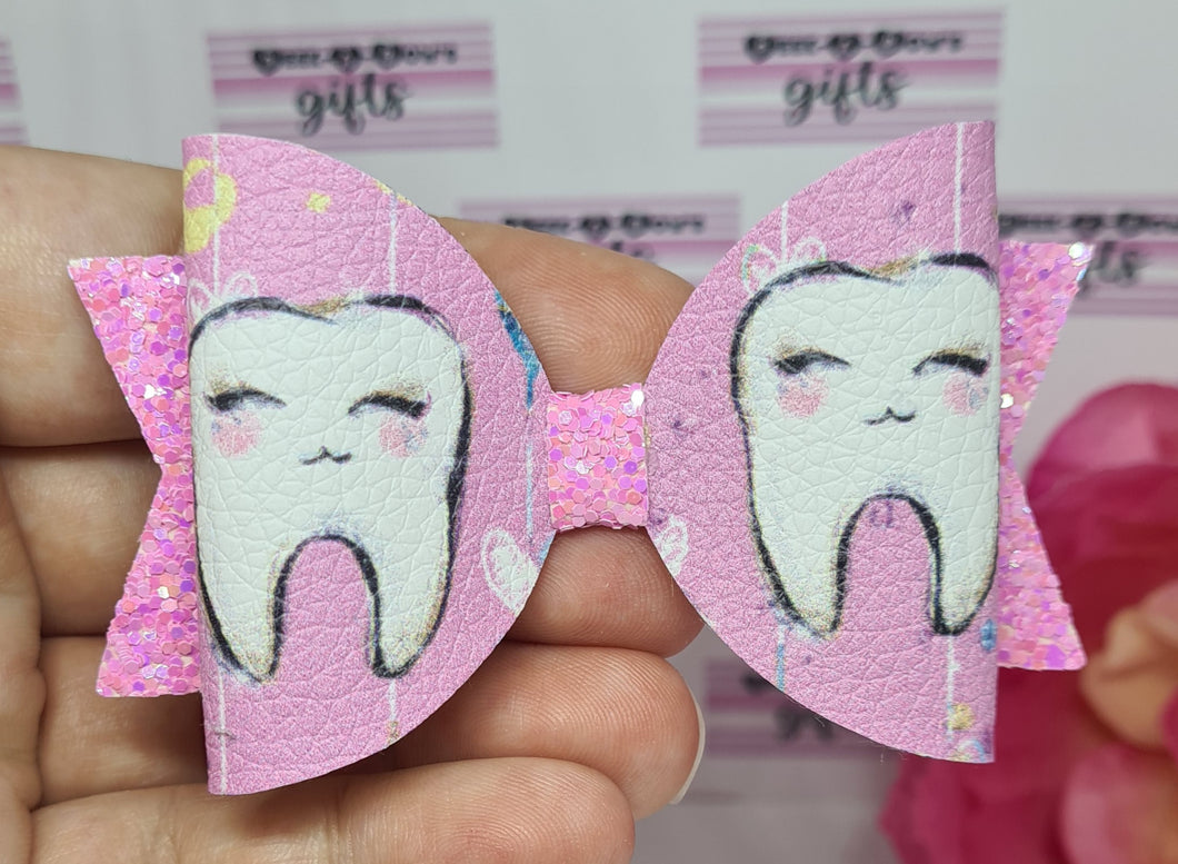 Pink tooth bow