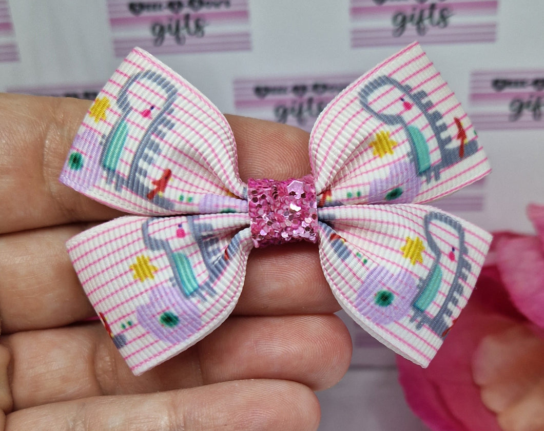 Pink dinos ribbon bow