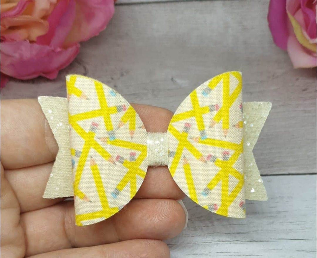 Cream pencil bow